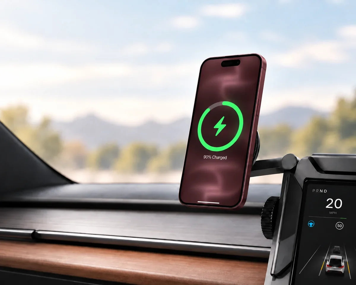 Orange phone charging upright on a compact black magnetic head beside a car display.