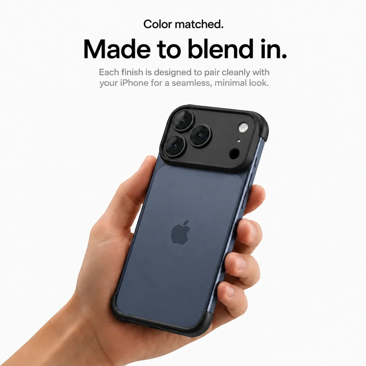 Black open-back phone bumper held upright in one hand #color_Midnight Black