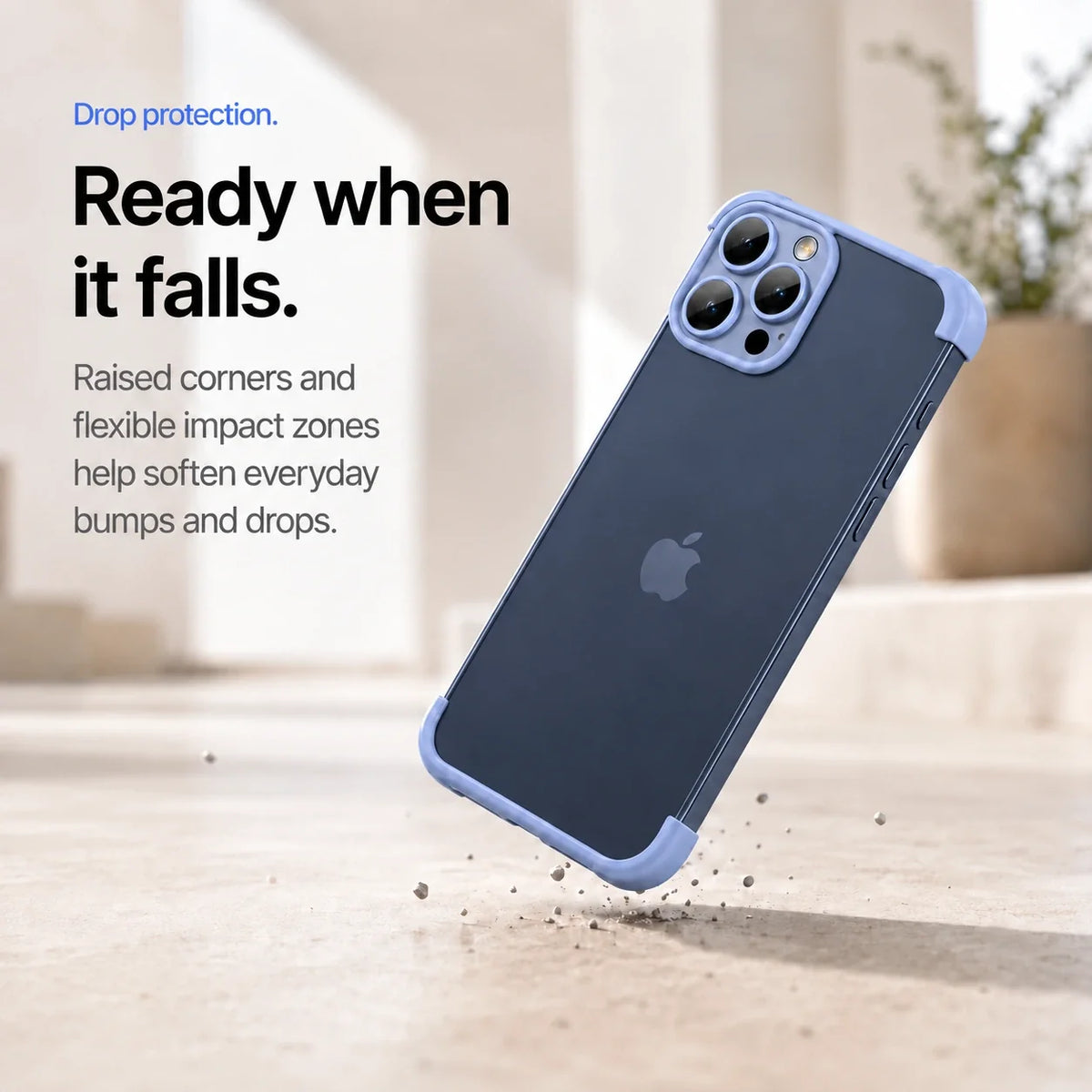 Blue phone bumper shown landing on a protected corner above a stone surface #color_Deep Blue