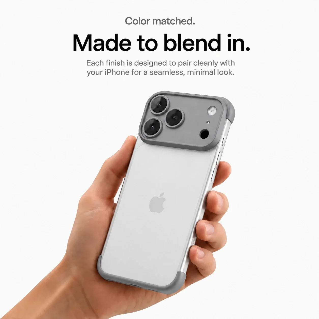 Gray open-back phone bumper held upright in one hand #color_Slate Gray