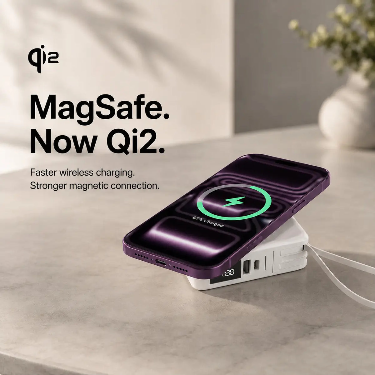 Arctic White travel power bank charging a Burgundy phone magnetically. #color_Arctic White