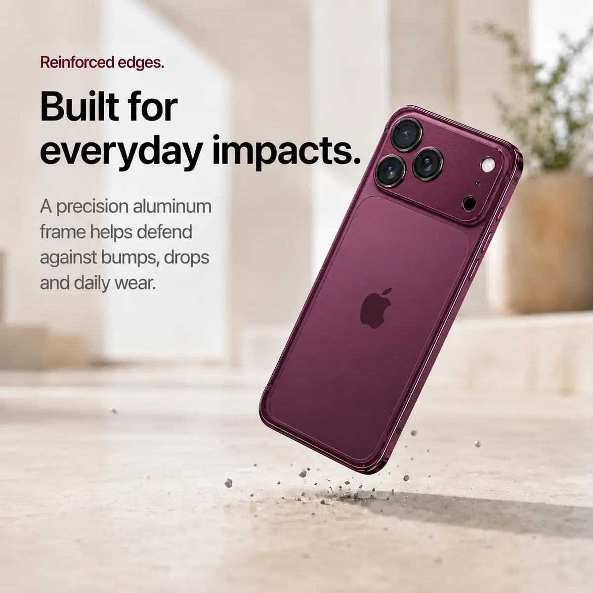 Burgundy aluminum bumper phone case shown during a corner drop demonstration #color_Burgundy