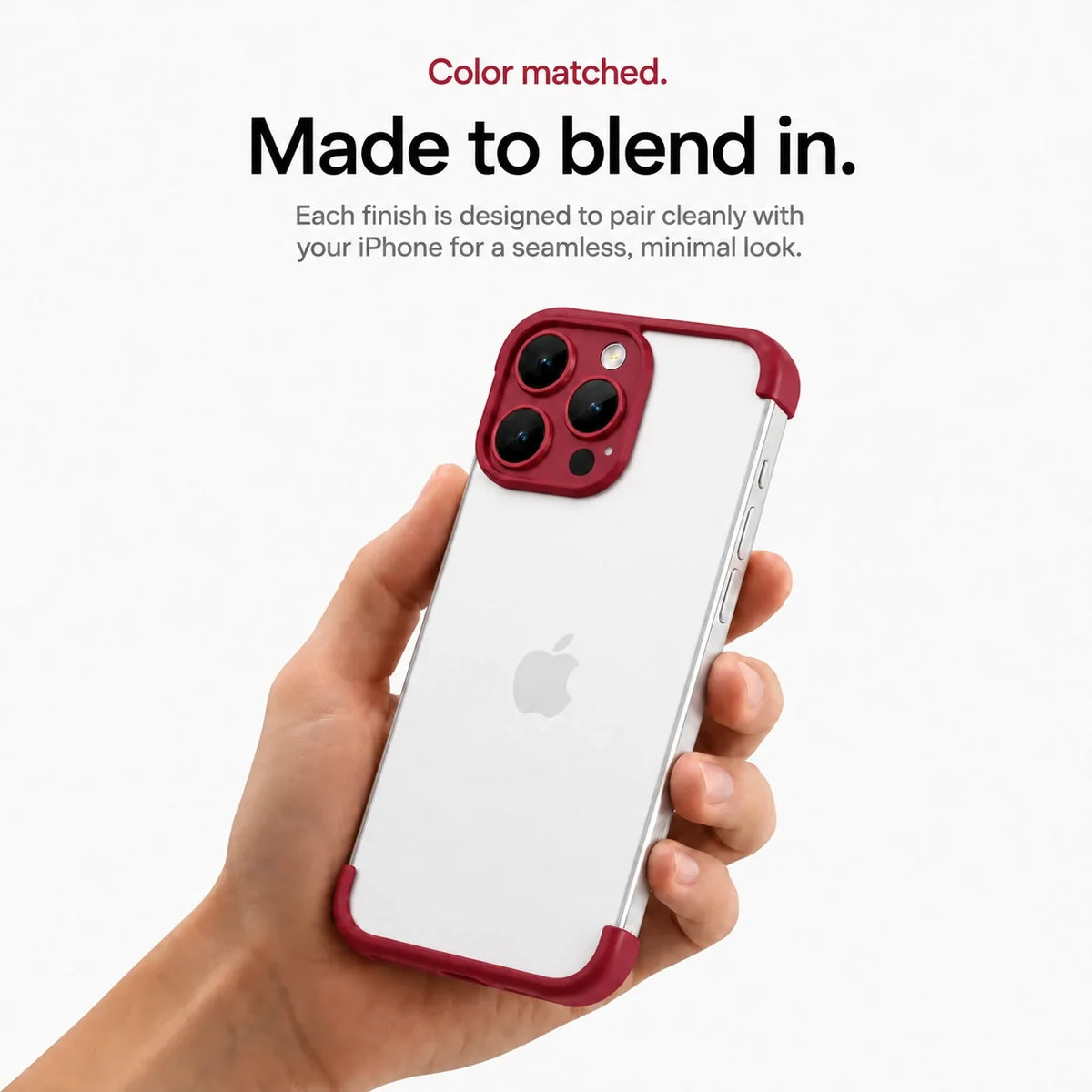 Red open-back phone bumper held upright in one hand #color_Crimson Red