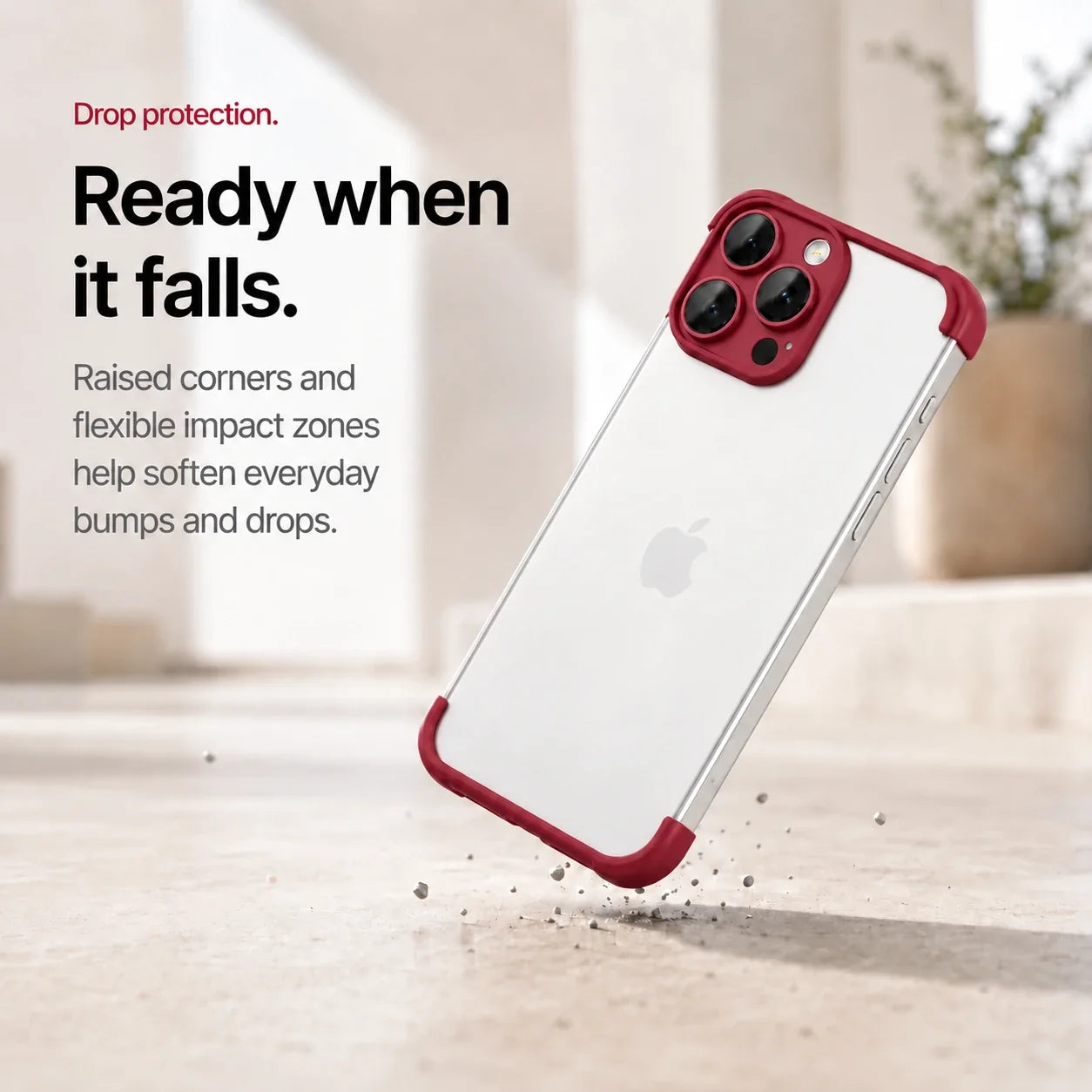 Red phone bumper shown landing on a protected corner above a stone surface #color_Crimson Red